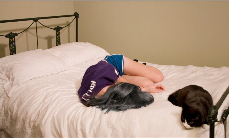 Person Sleeping on Bed — White