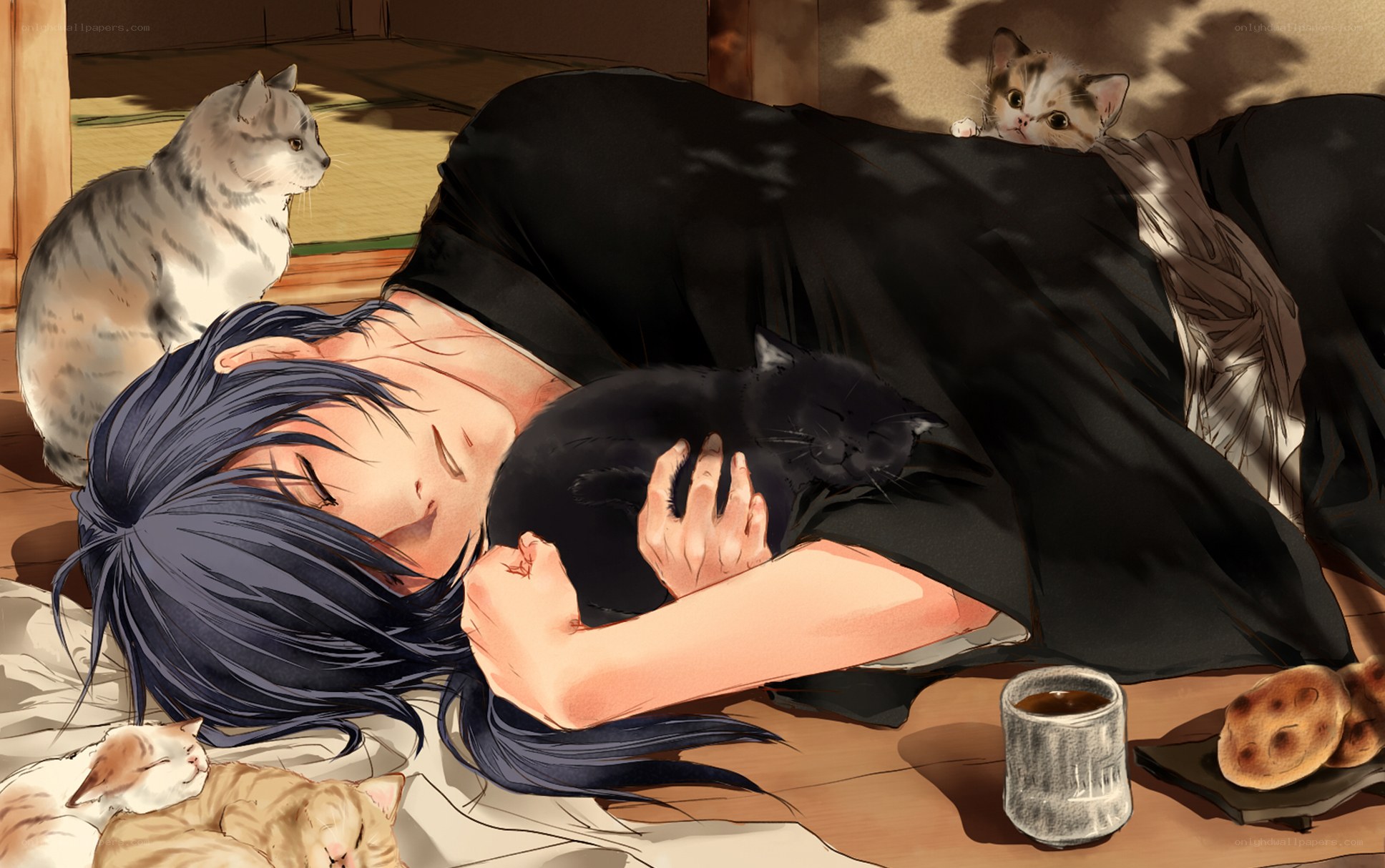 Person sleeping with cats