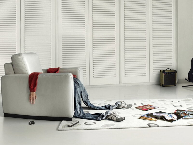 Person slumped in armchair