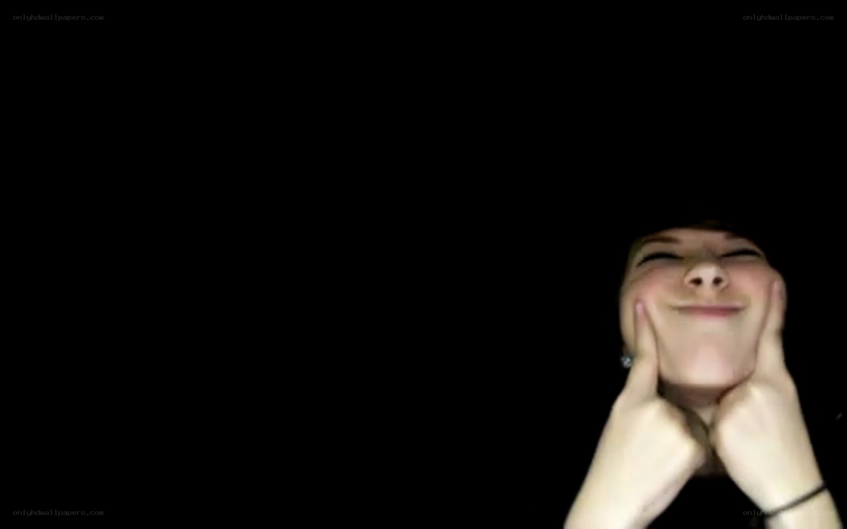 person smiling in dark