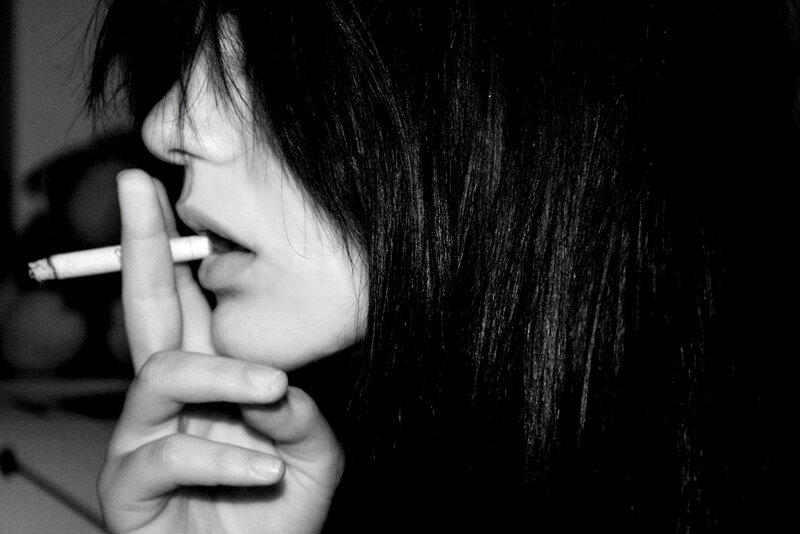 person smoking a cigarette