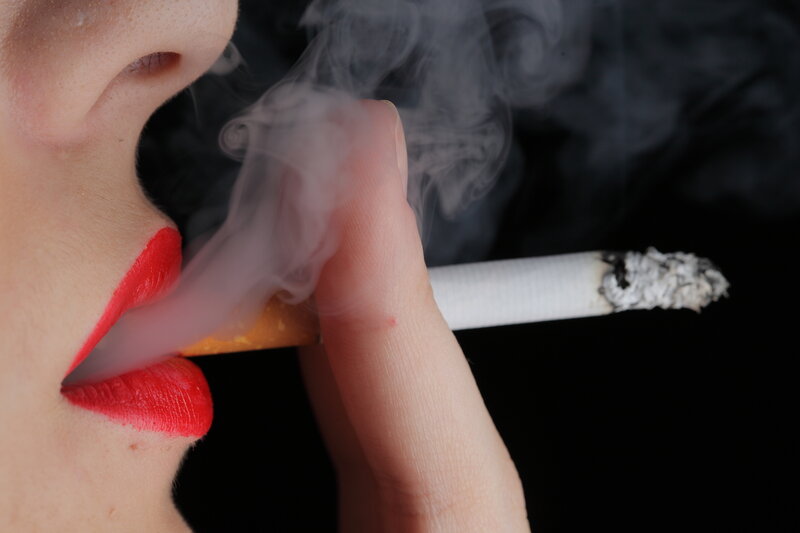 Person Smoking Cigarette — Black