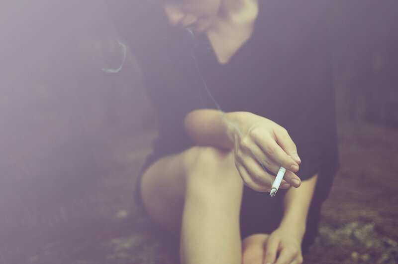 Person Smoking Cigarette — Purple