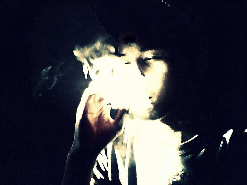 person smoking in dark