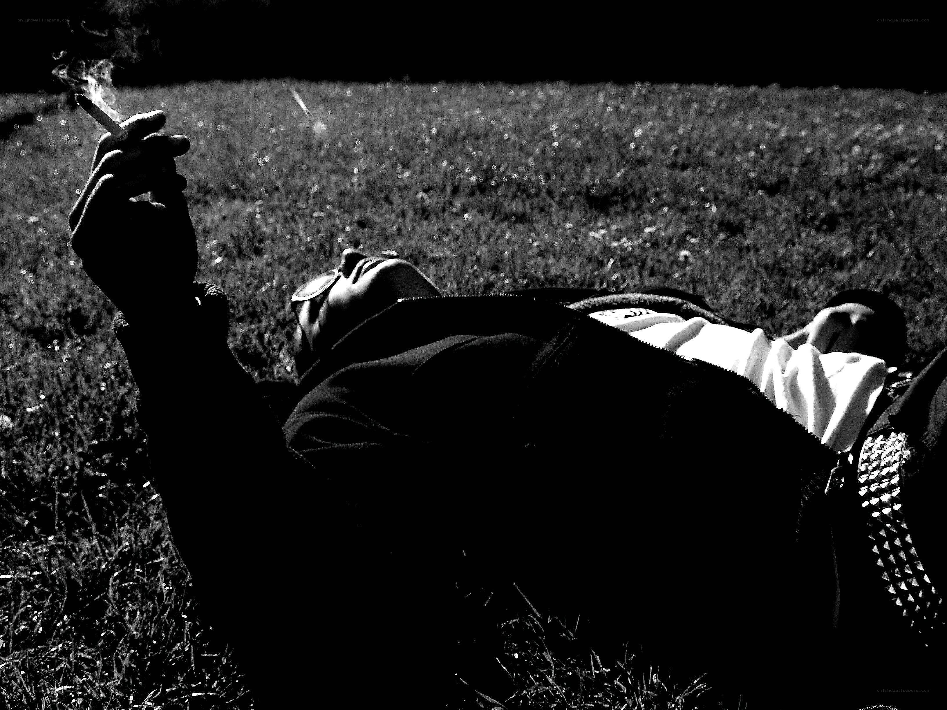 Person smoking on grass
