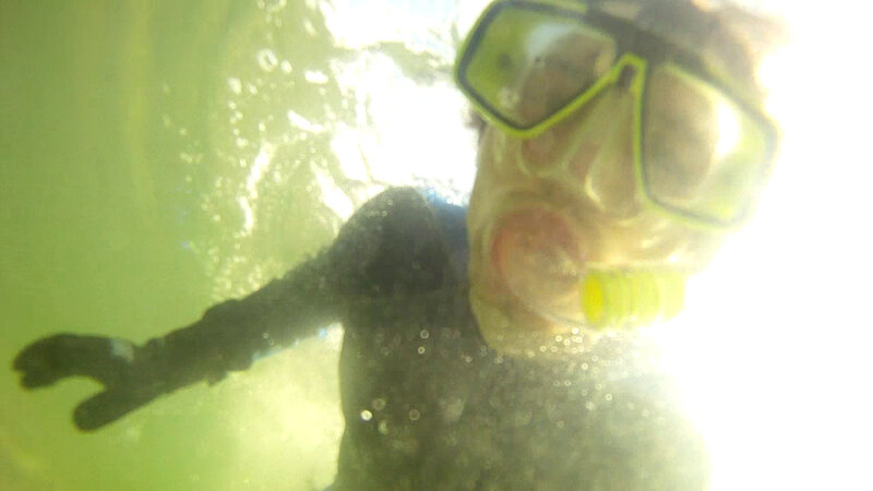 person snorkeling underwater