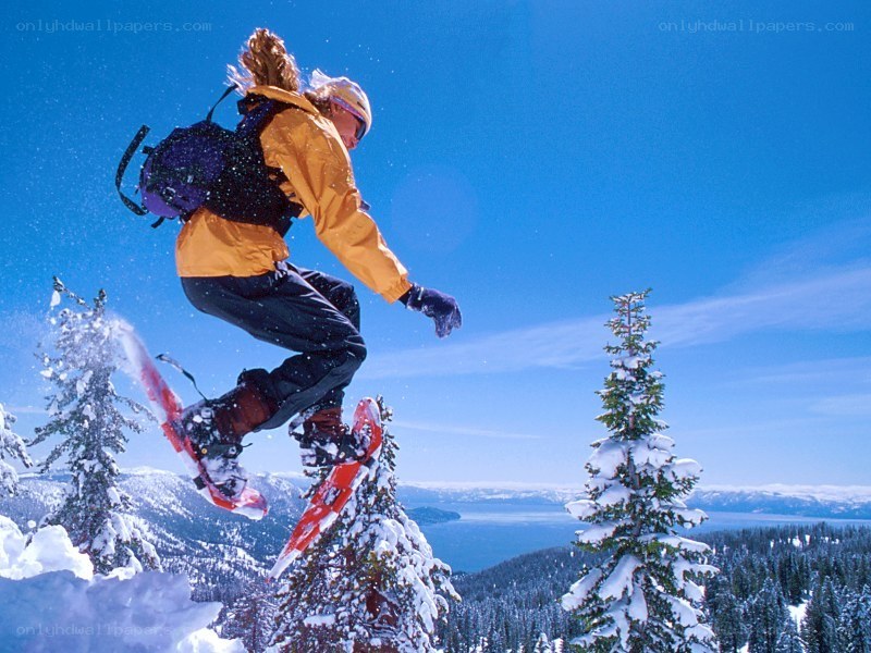 person snowshoeing on mountain