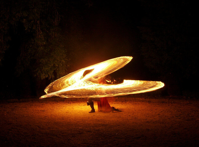 Person Spinning Fire Fans