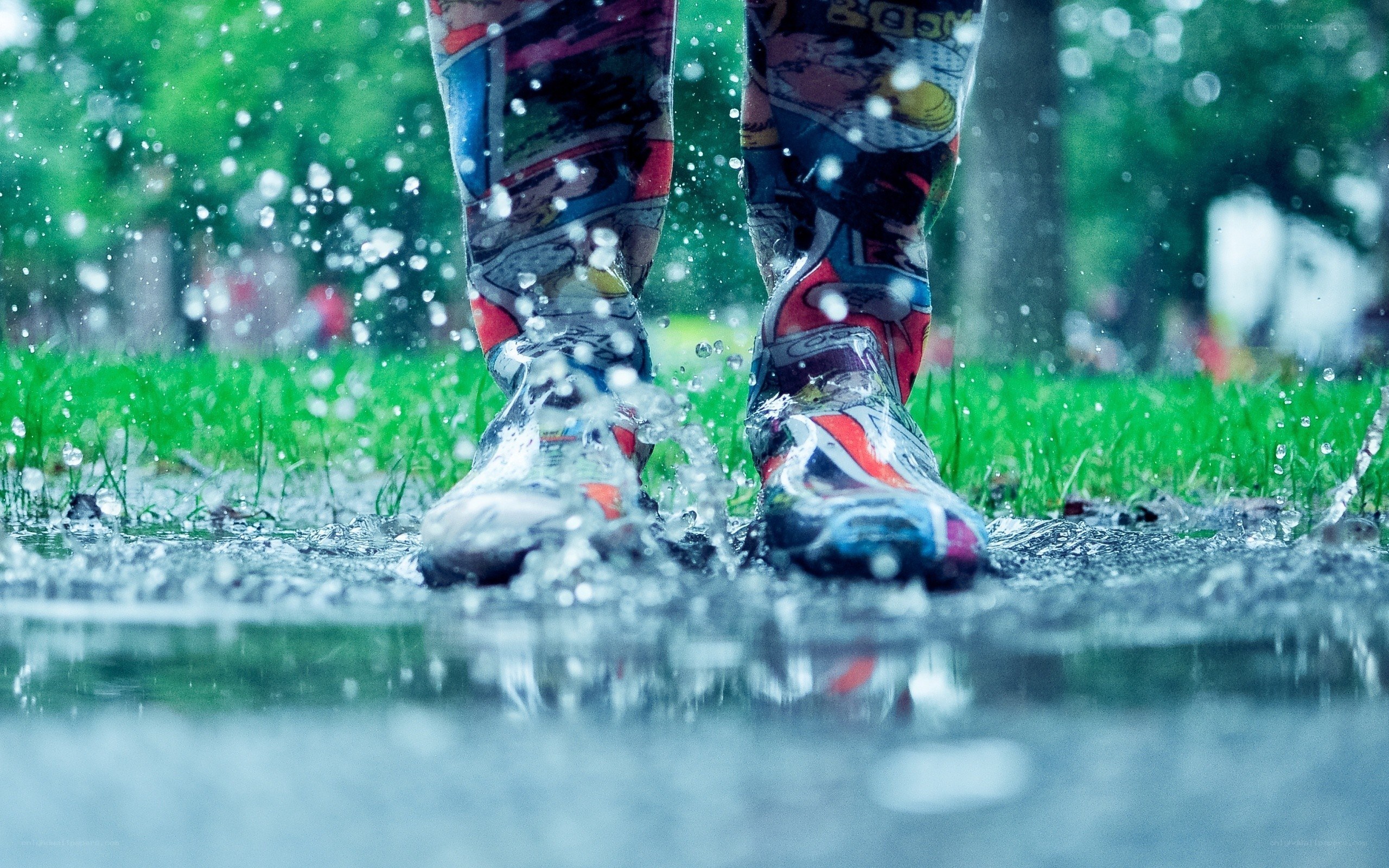 person splashing in a puddle