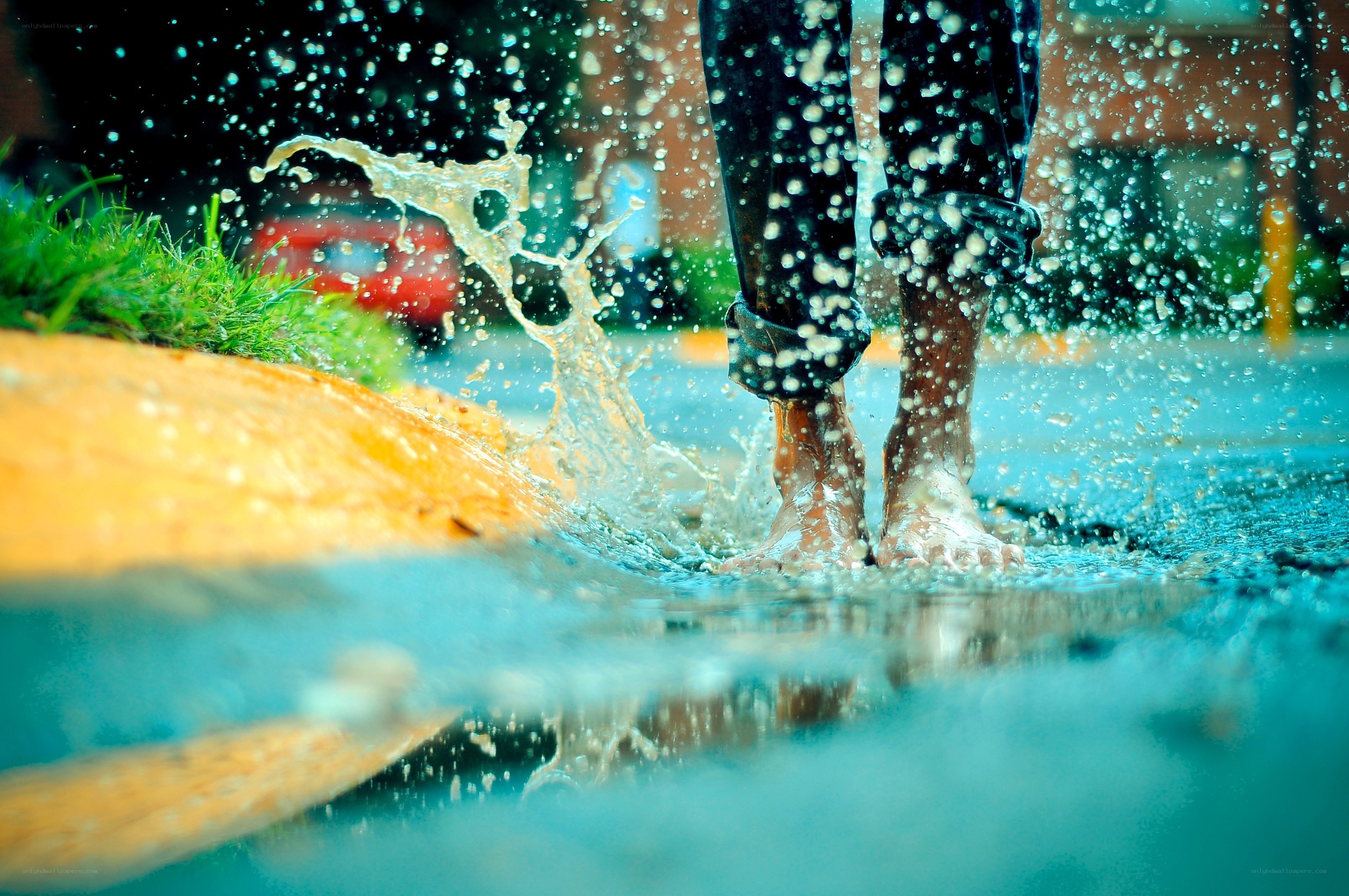 person splashing in a puddle