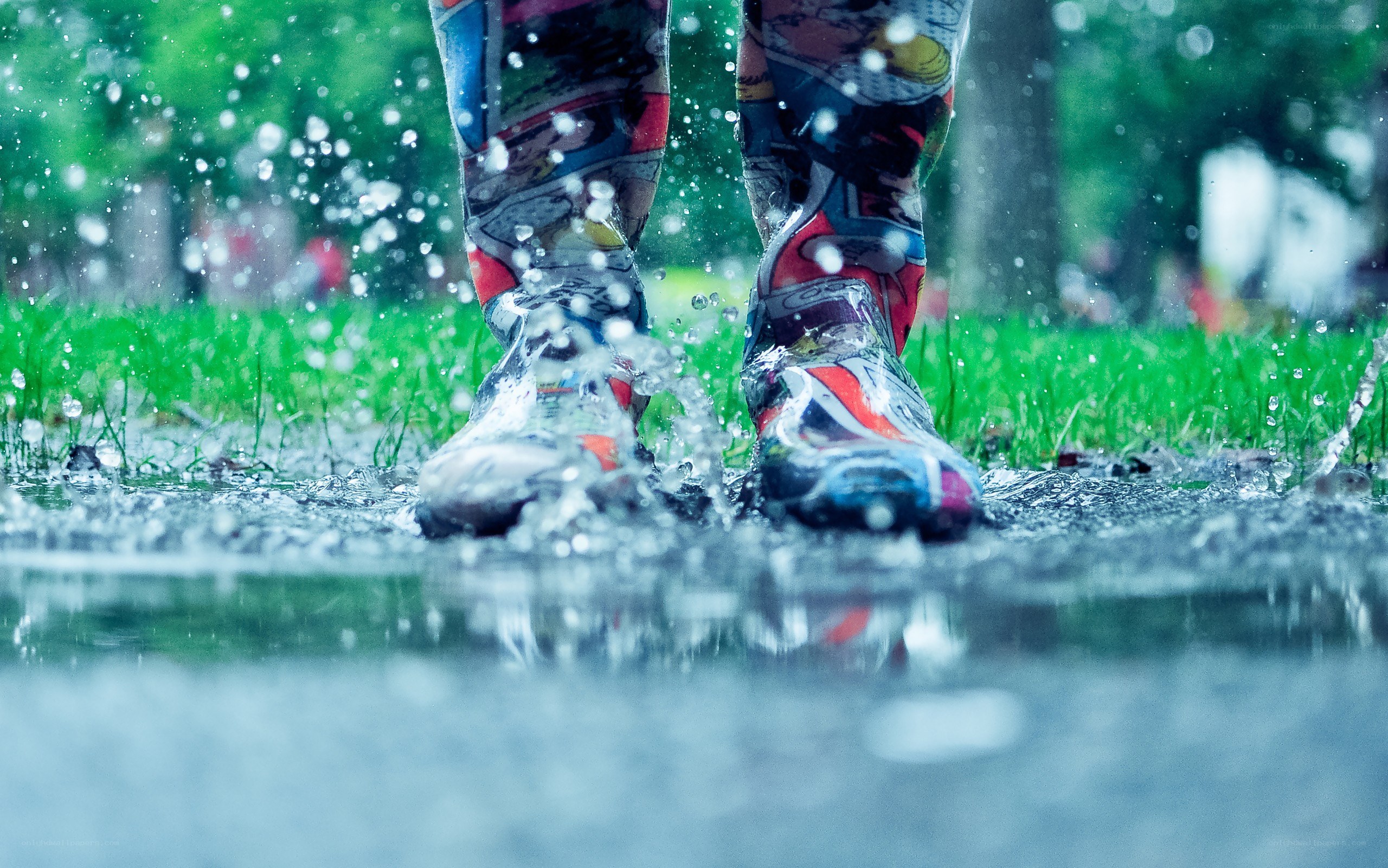person splashing in a puddle