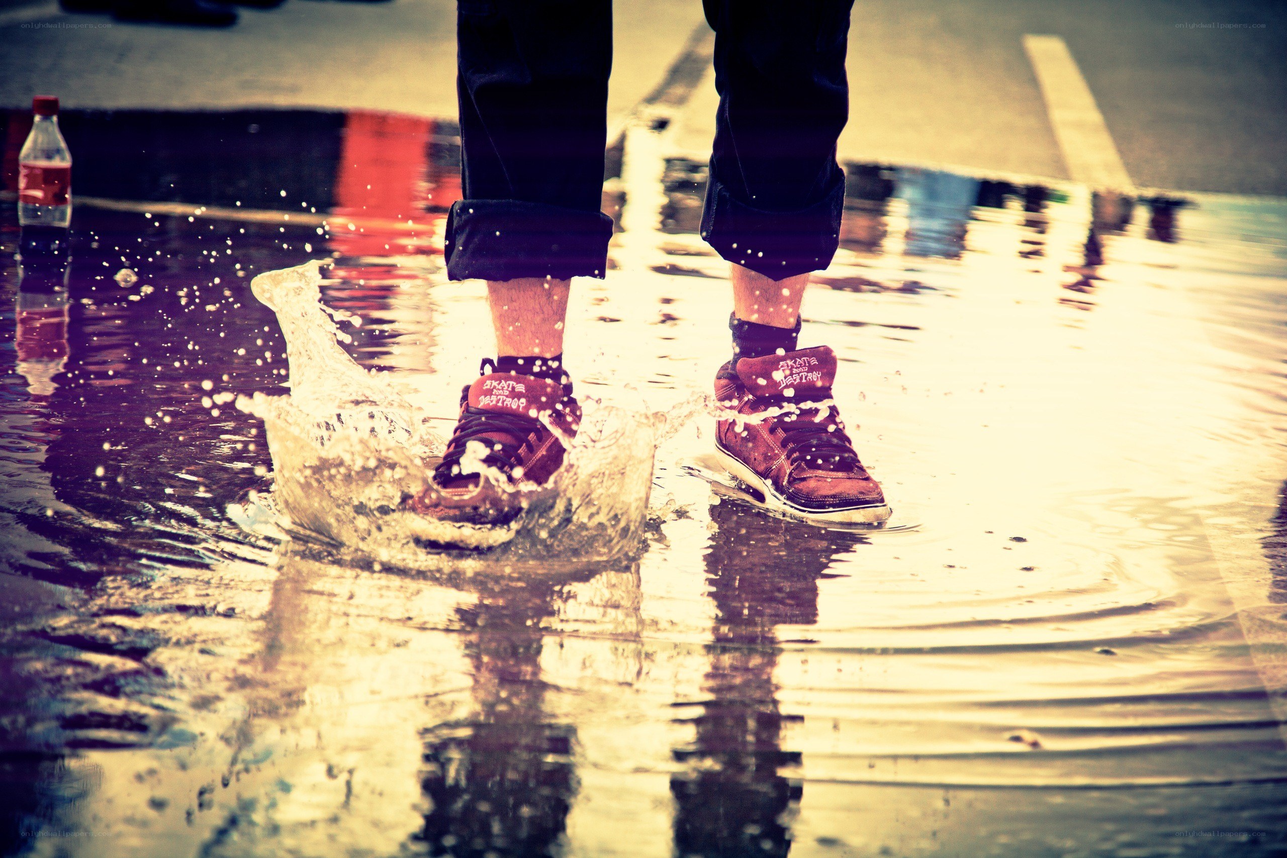 person splashing in a puddle