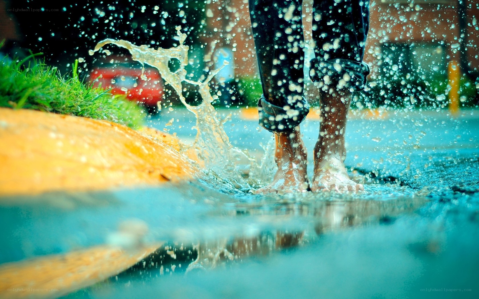 person splashing in a puddle