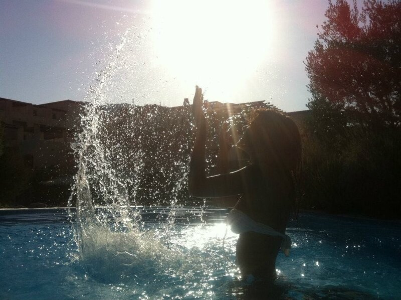 person splashing in pool