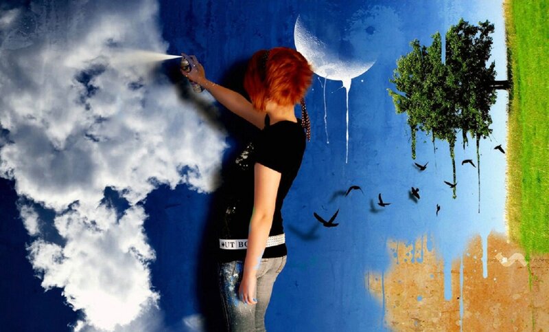 Person Spray Painting Mural