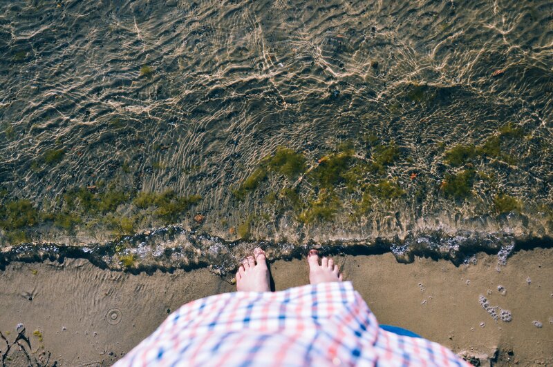 Person Standing at Shoreline
