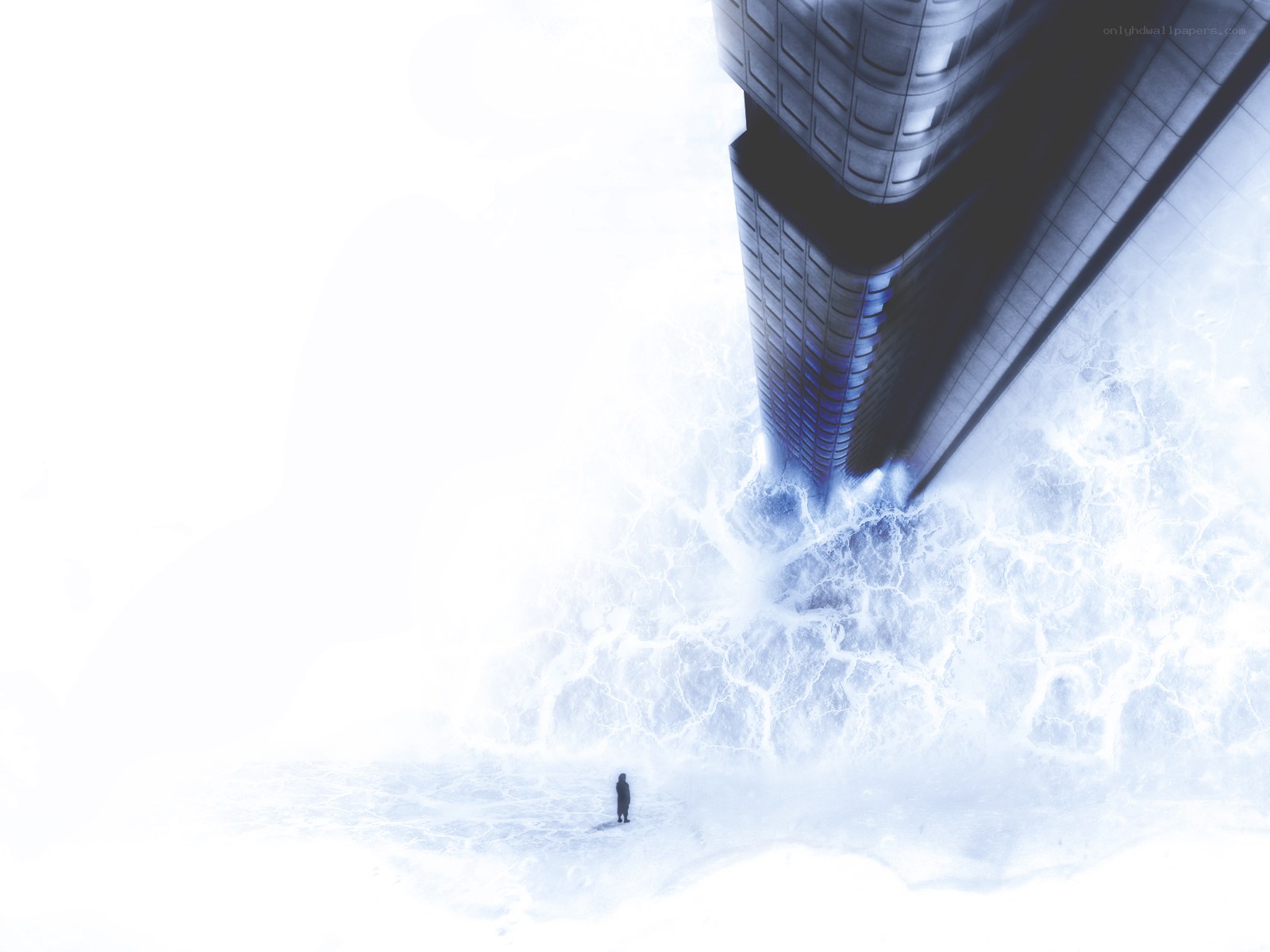 Person standing before a towering building
