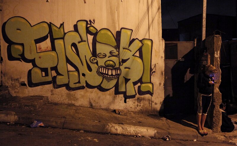 Person Standing by Graffiti