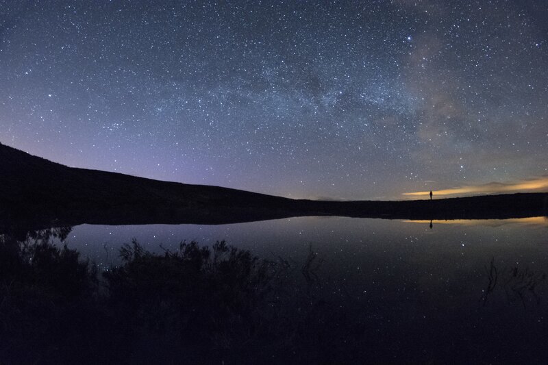 Person Standing by Lake — Blue, Serene, Night