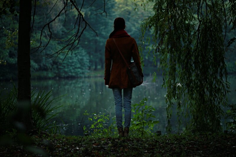 Person Standing by Lake — Green