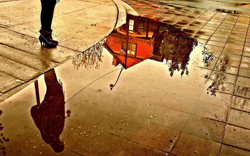Person Standing by Puddle