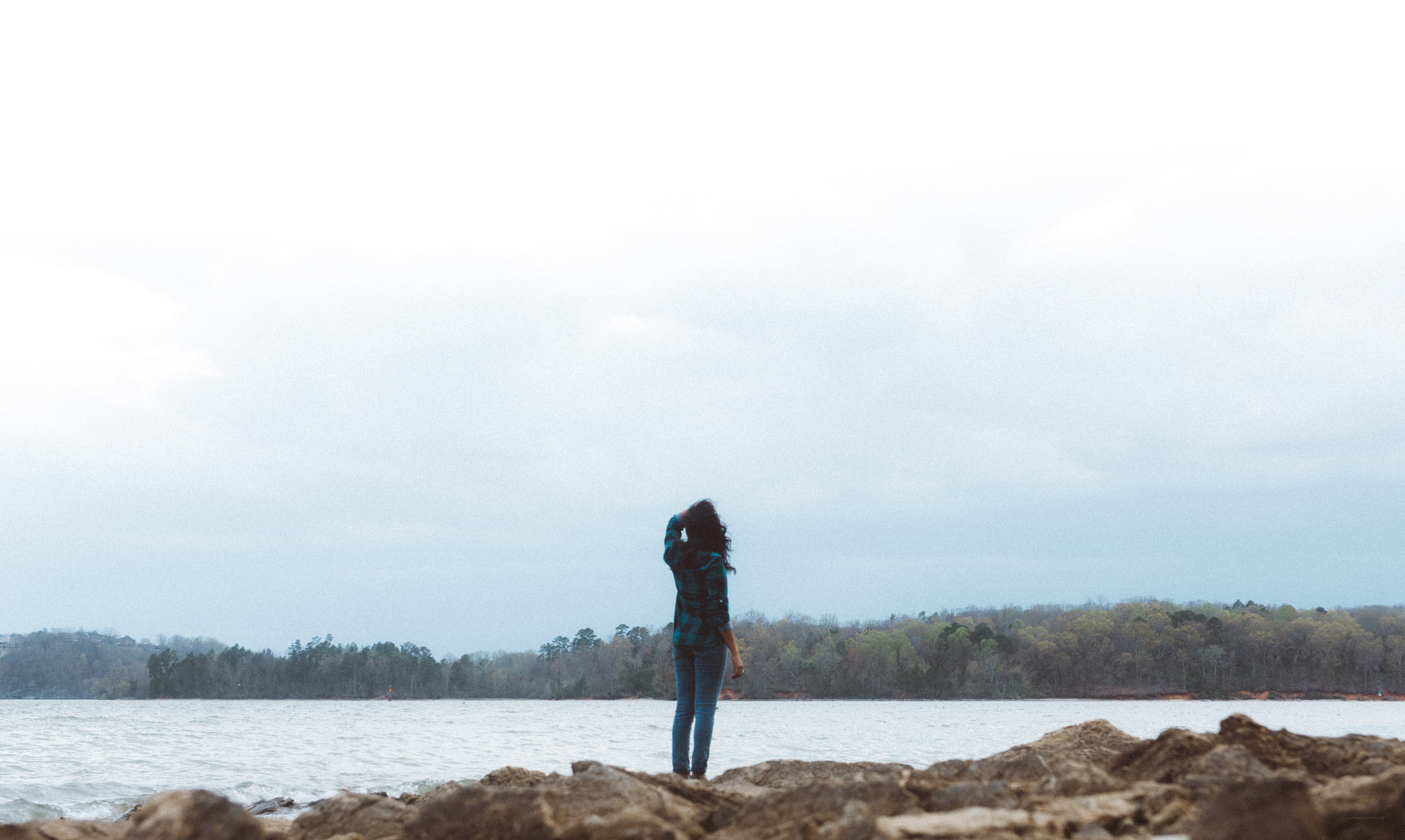 person standing by the water