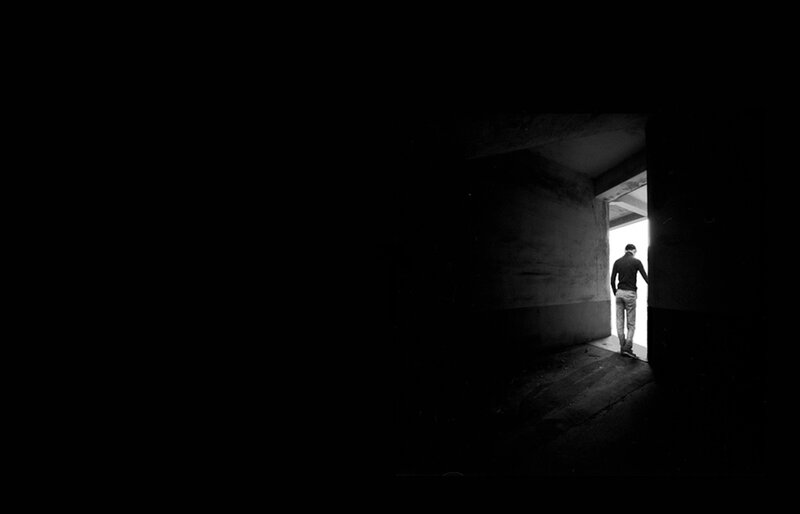 Person Standing in Doorway