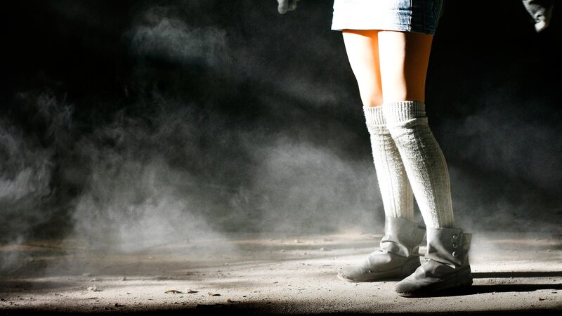 person standing in dust