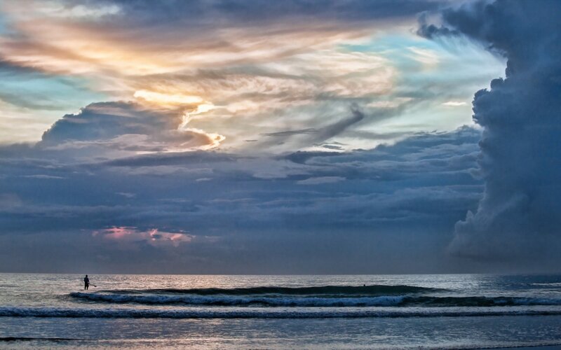 Person Standing in Ocean — Blue, Dramatic