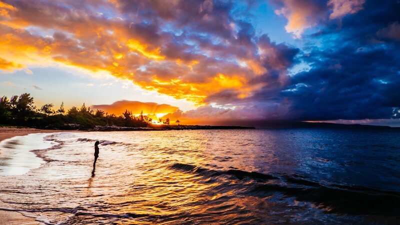 Person Standing in Ocean — Orange, Dramatic