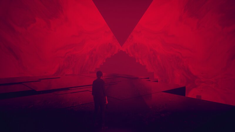 Person Standing in Red Cave