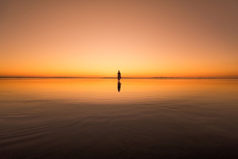 Person Standing in Water — Orange