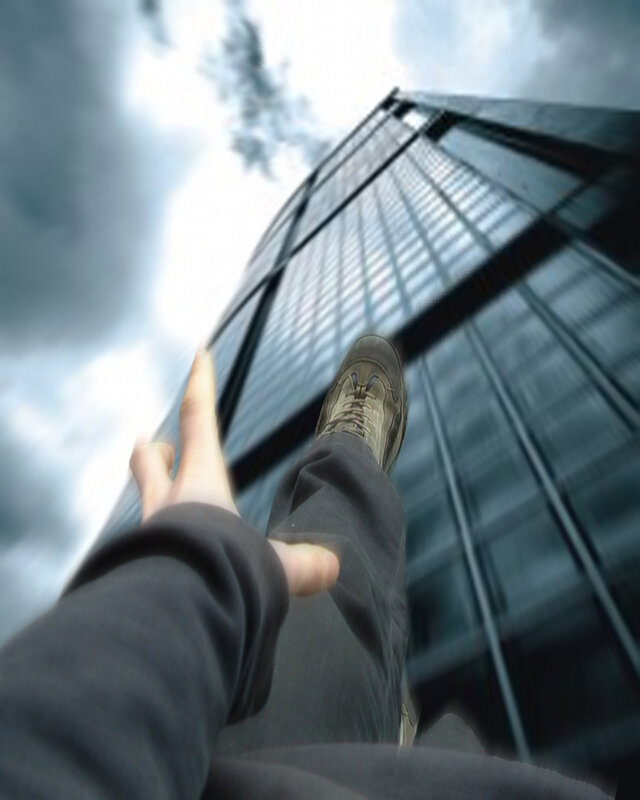 person standing near skyscraper