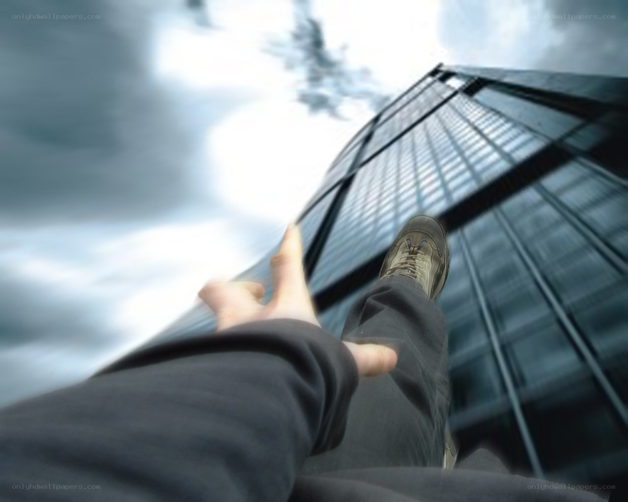person standing near skyscraper