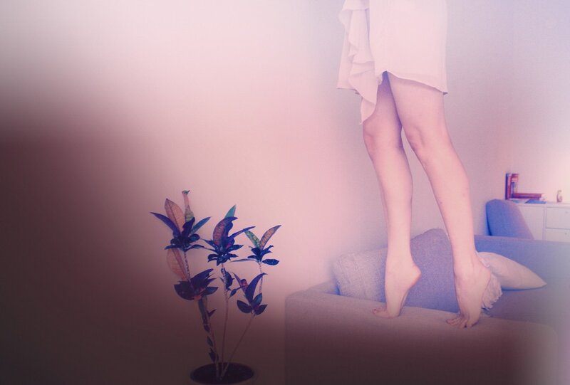 person standing on a couch