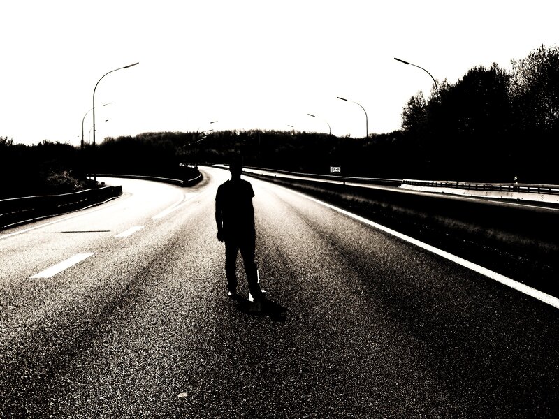 person standing on a road