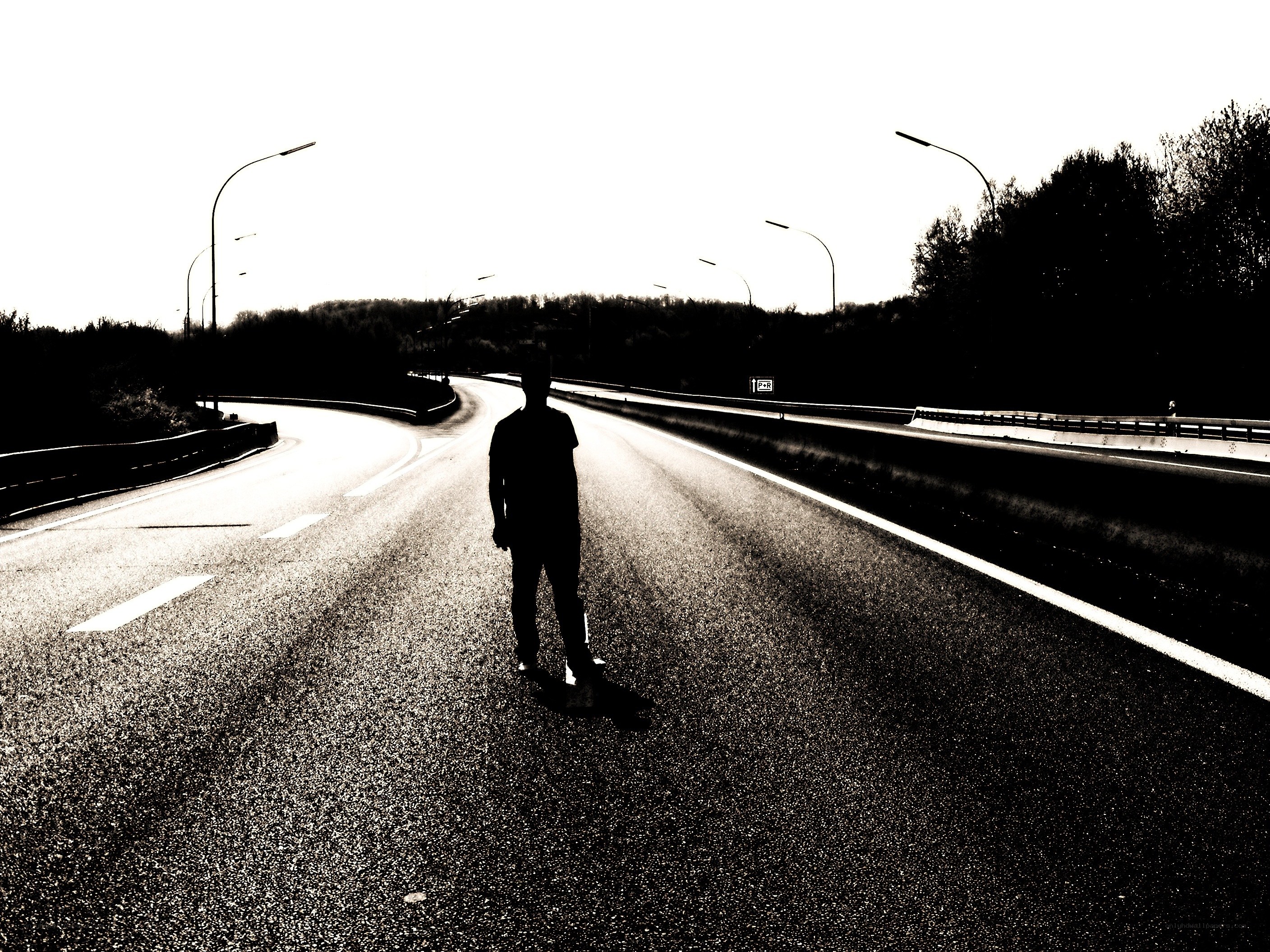 person standing on a road