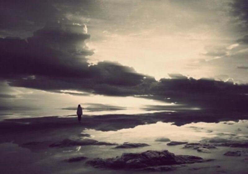 Person Standing on Beach — Gray, Dramatic