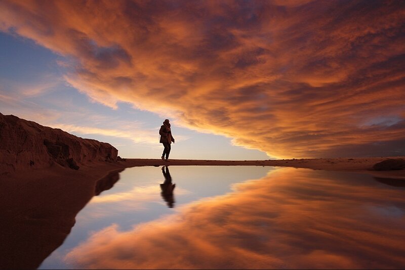 Person Standing on Beach — Orange
