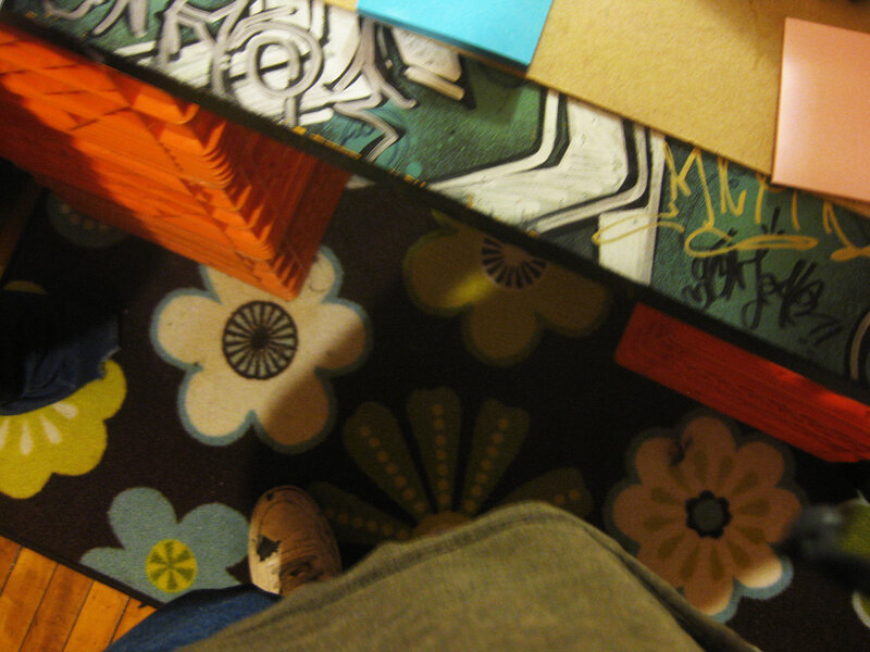 person standing on floral rug