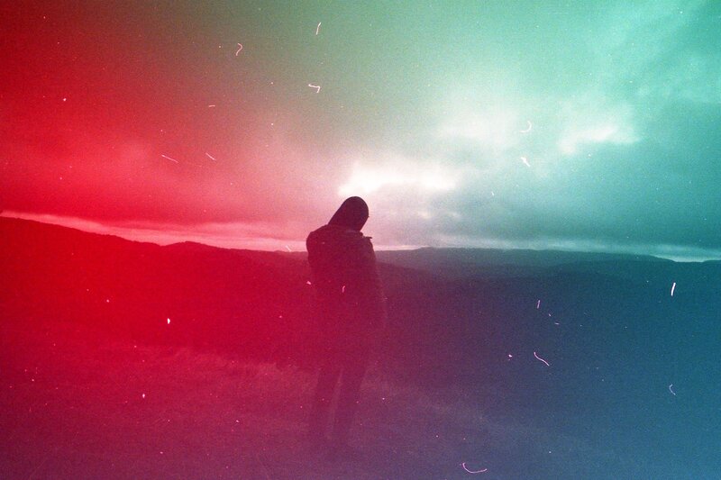 Person Standing on Hill — Red, Dramatic