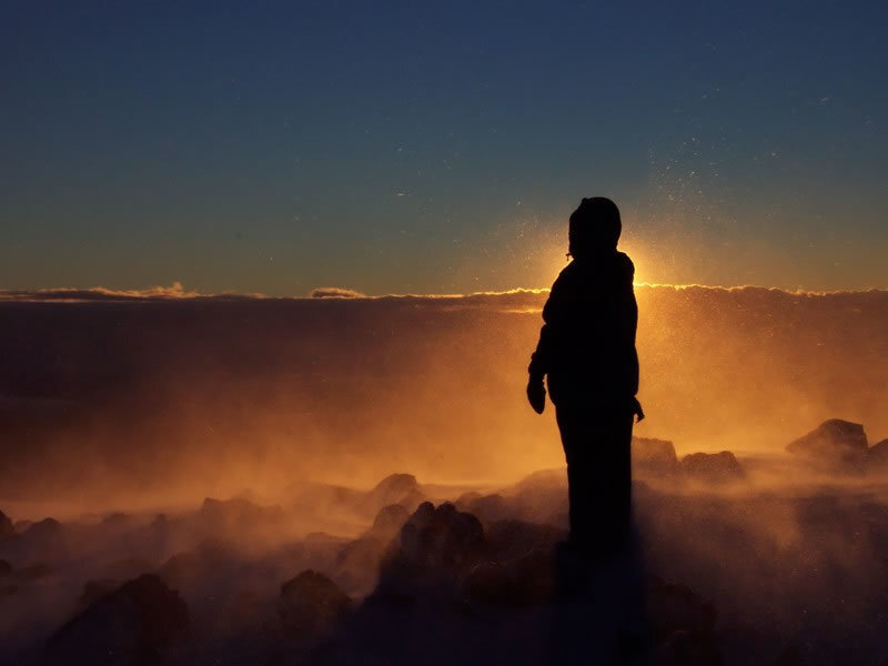 Person Standing on Mountain — Orange