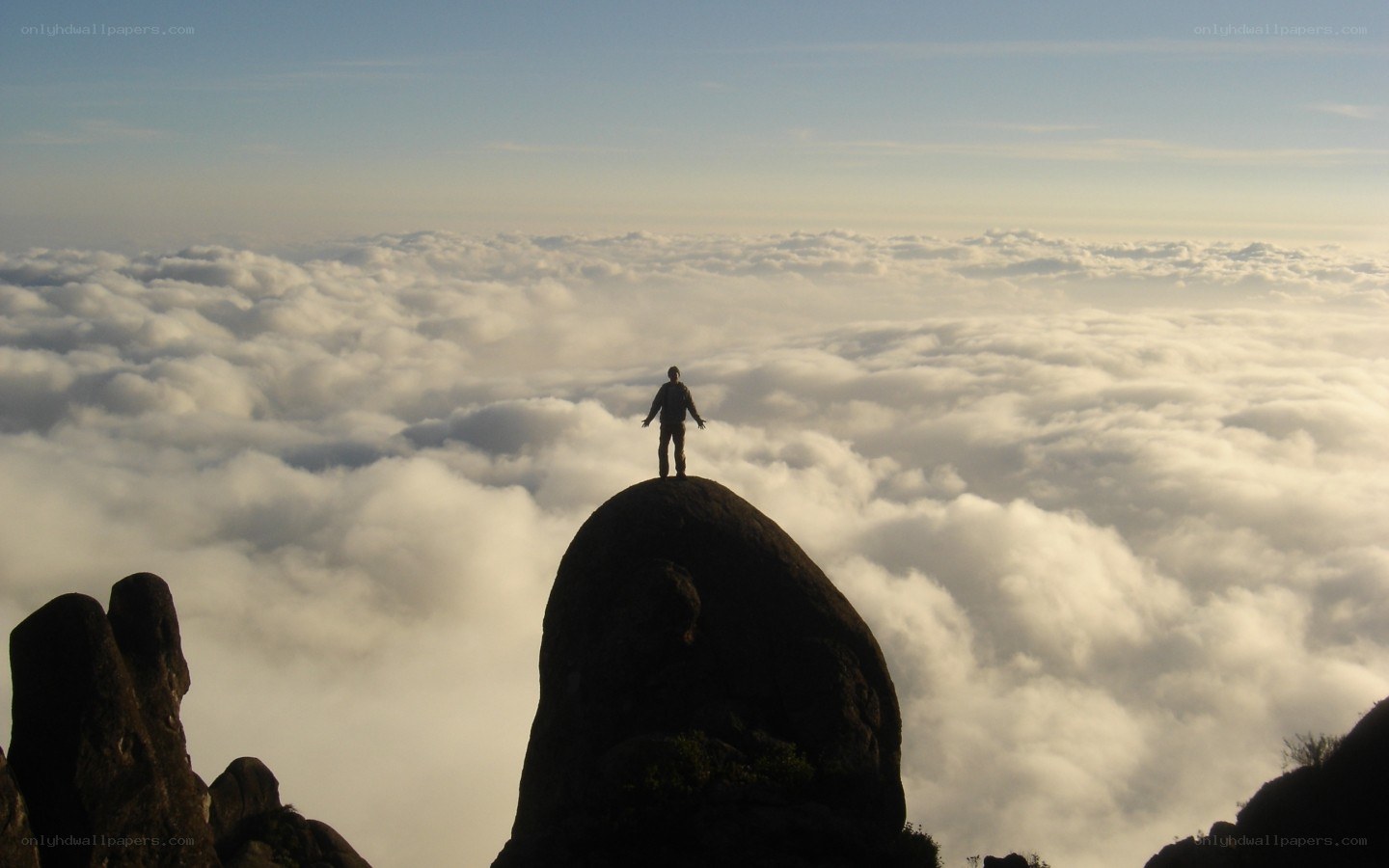 person standing on mountain peak