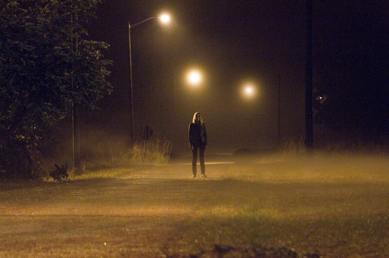 Person Standing on Path — Yellow