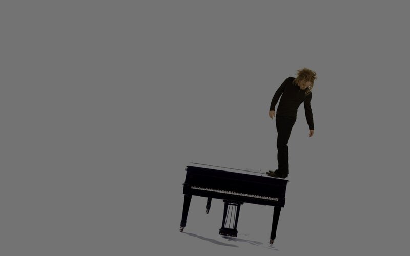 Person Standing on Piano