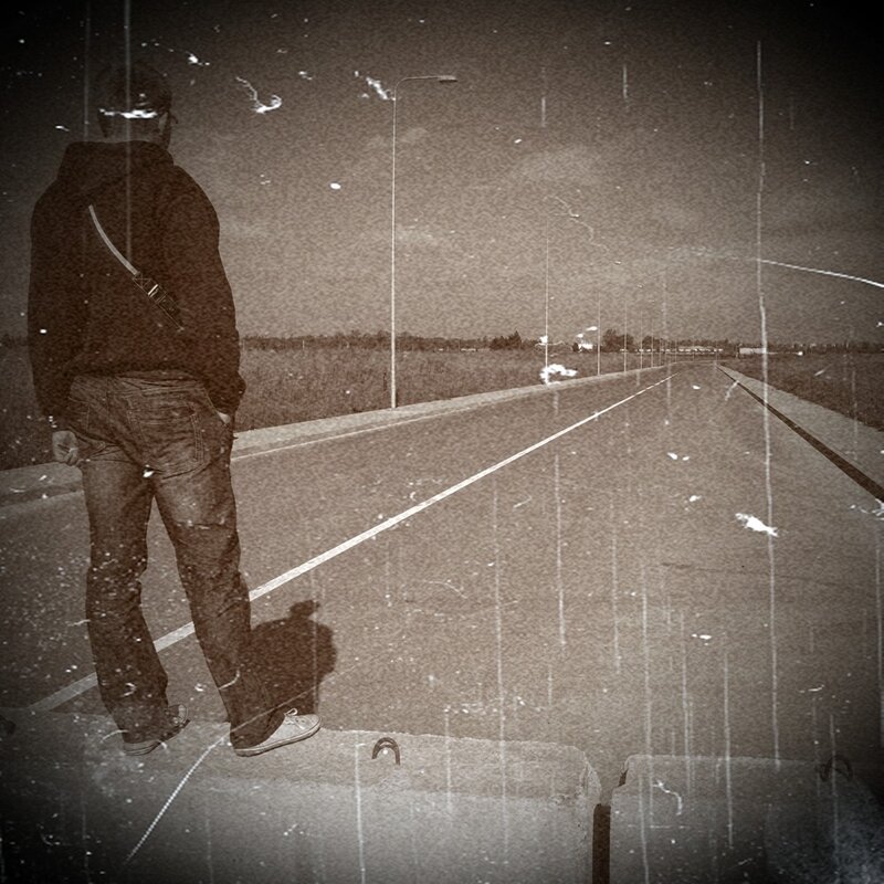 person standing on road