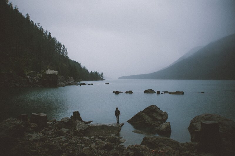 Person Standing on Rock — Gray, Somber