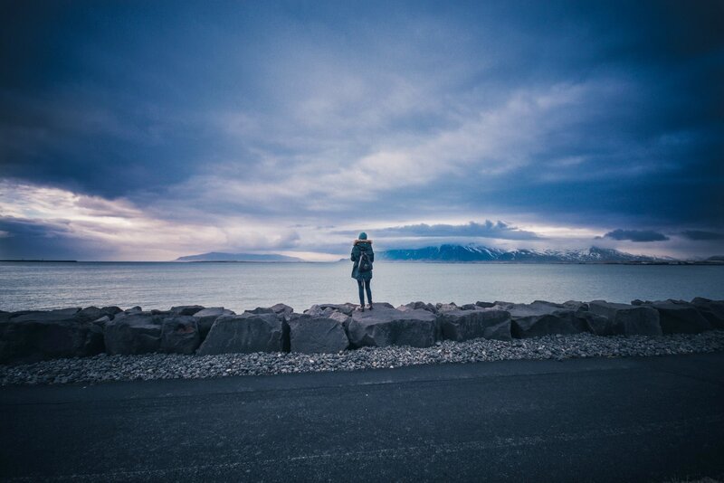 Person Standing on Rocks — Blue, Dramatic, Sunset