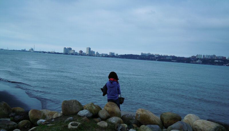 Person Standing on Rocks — Blue