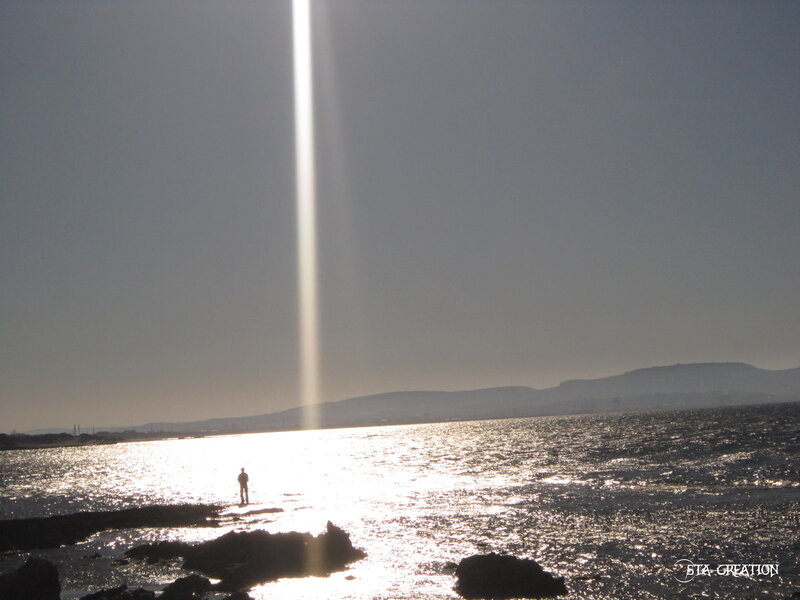 Person Standing on Rocks — Gray